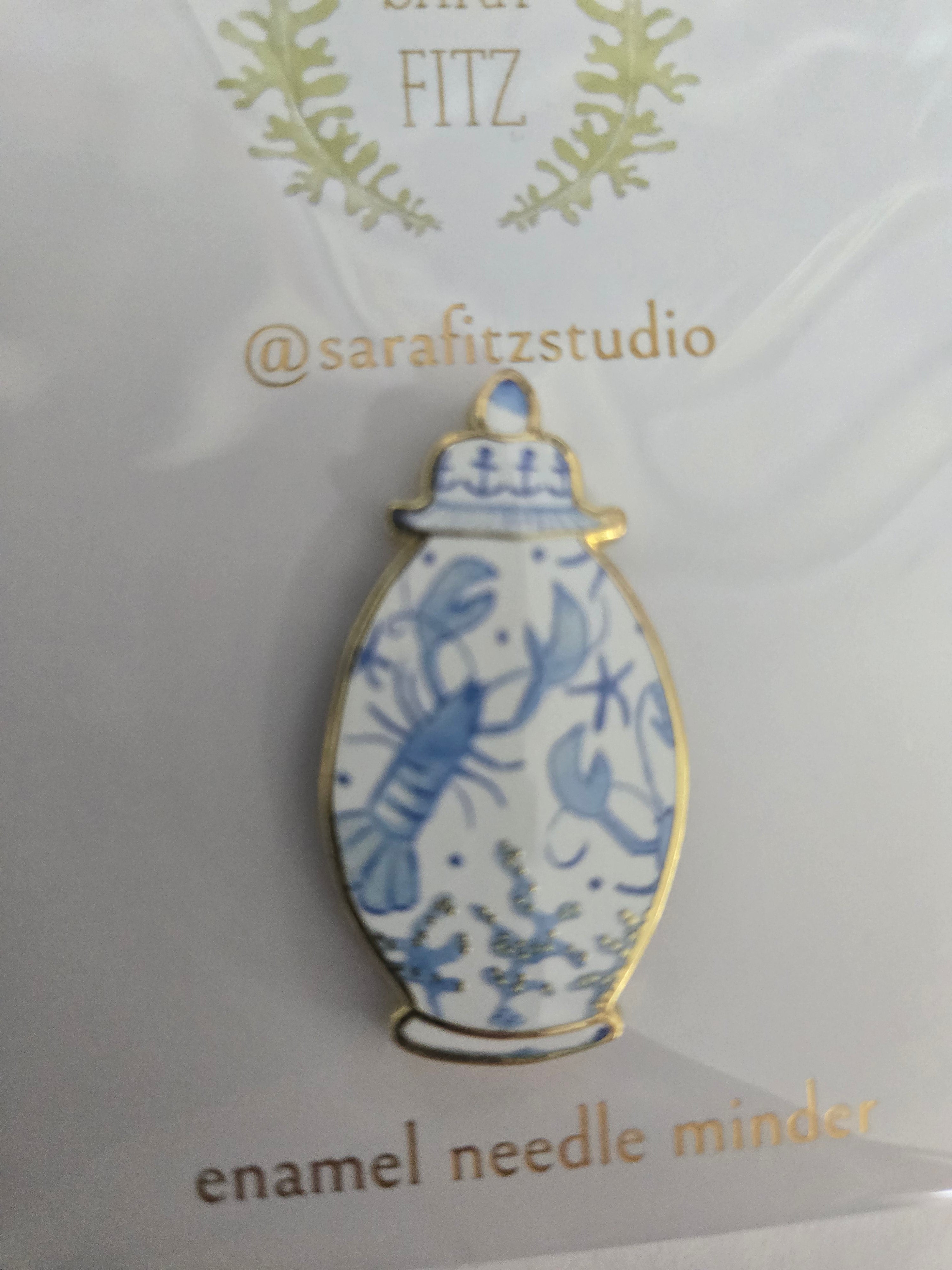 Enamel ginger jar needle minder with blue floral pattern