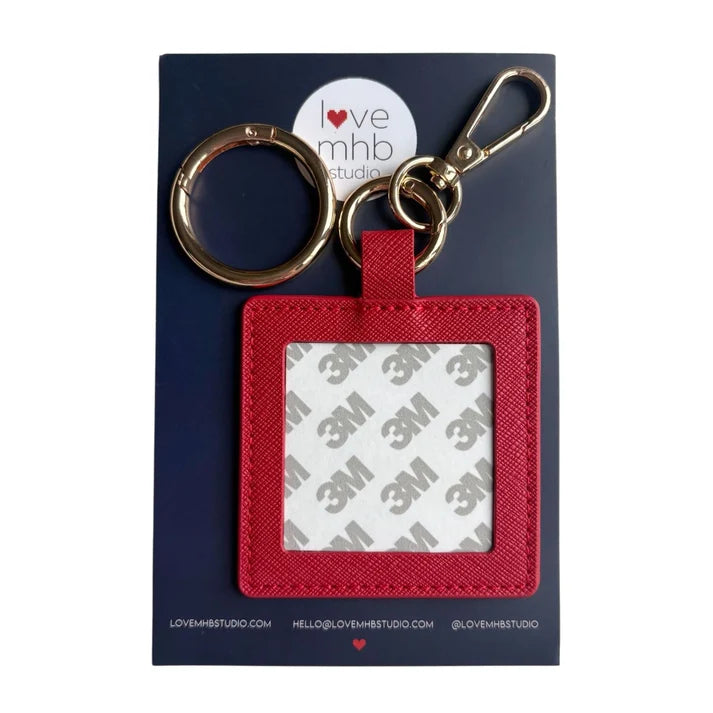 Red leather needle minder charm with metal key ring and rectangular label holder